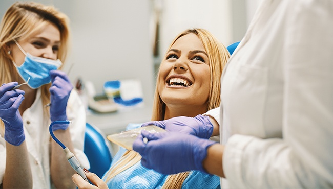 woman laughing in dental chair