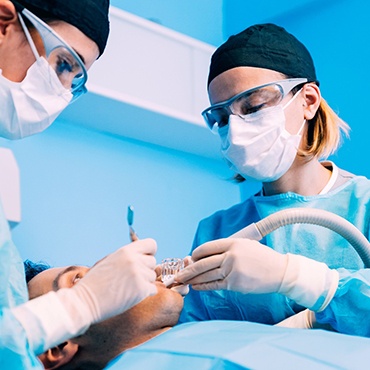 Dentists performing surgery