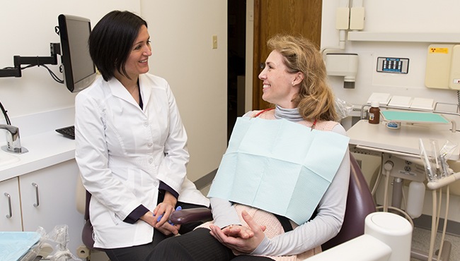 dentist with female patient