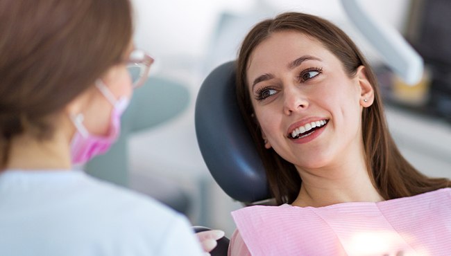 woman smiling at team member