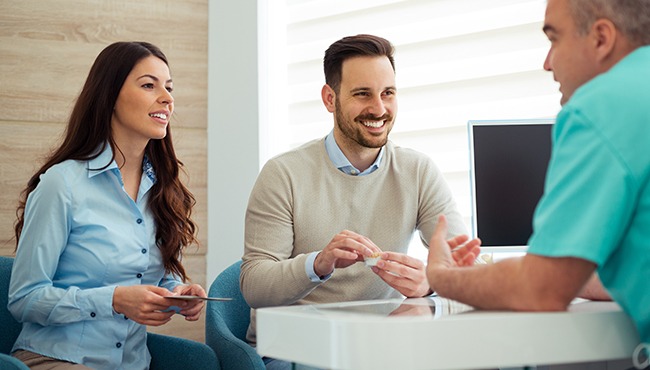 man and woman in consultation room