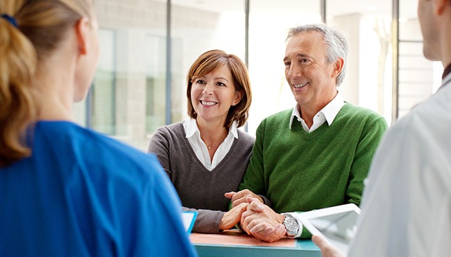 man and woman at front desk