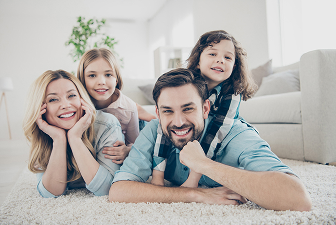 husband and wife with two daughters