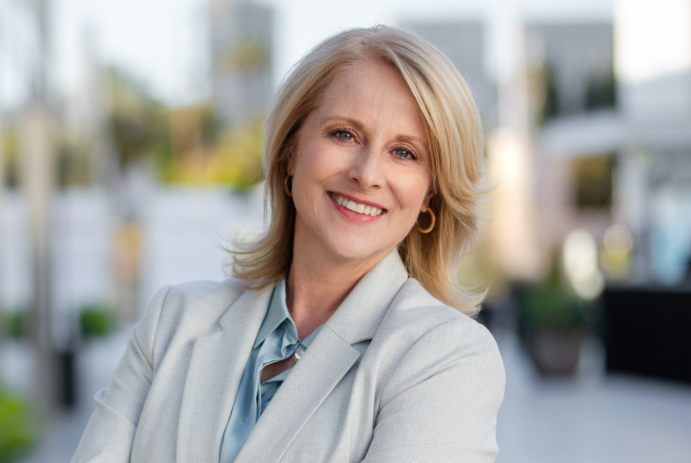 woman in business suit smiling