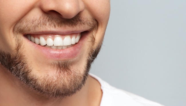 man with beard smiling