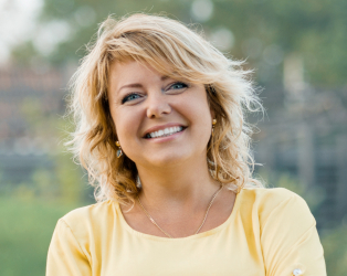 woman in yellow shirt smiling