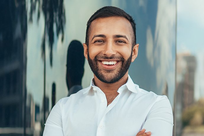 man in white shirt smiling