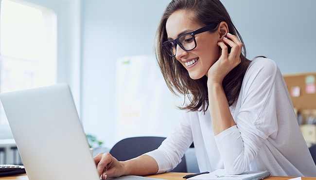 woman smiling while working