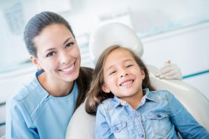 Pediatric dentist in Buffalo Grove teaches brushing and flossing.