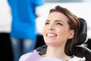 Woman with a beautiful smile in the dental chair. 