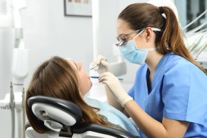 Dentist treating patient 