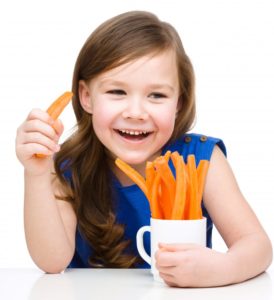 girl eating carrots 