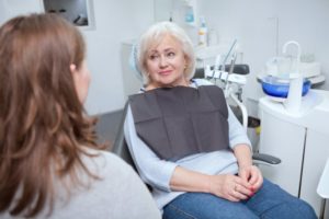 woman talking to dentist 