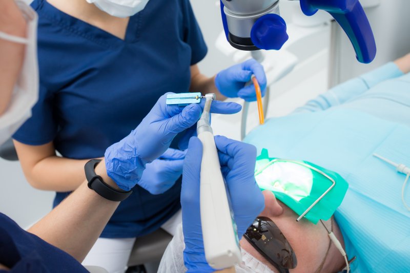 A patient receiving a root canal retreatment